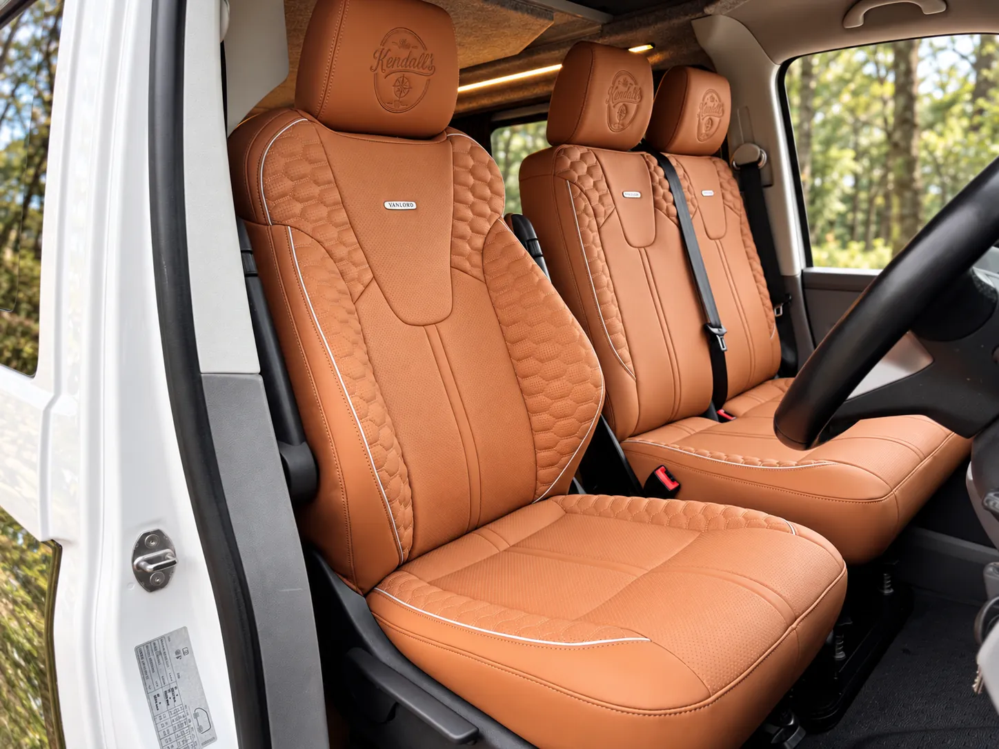 Tan quilted Vantek seats inside a Vanlord campervan