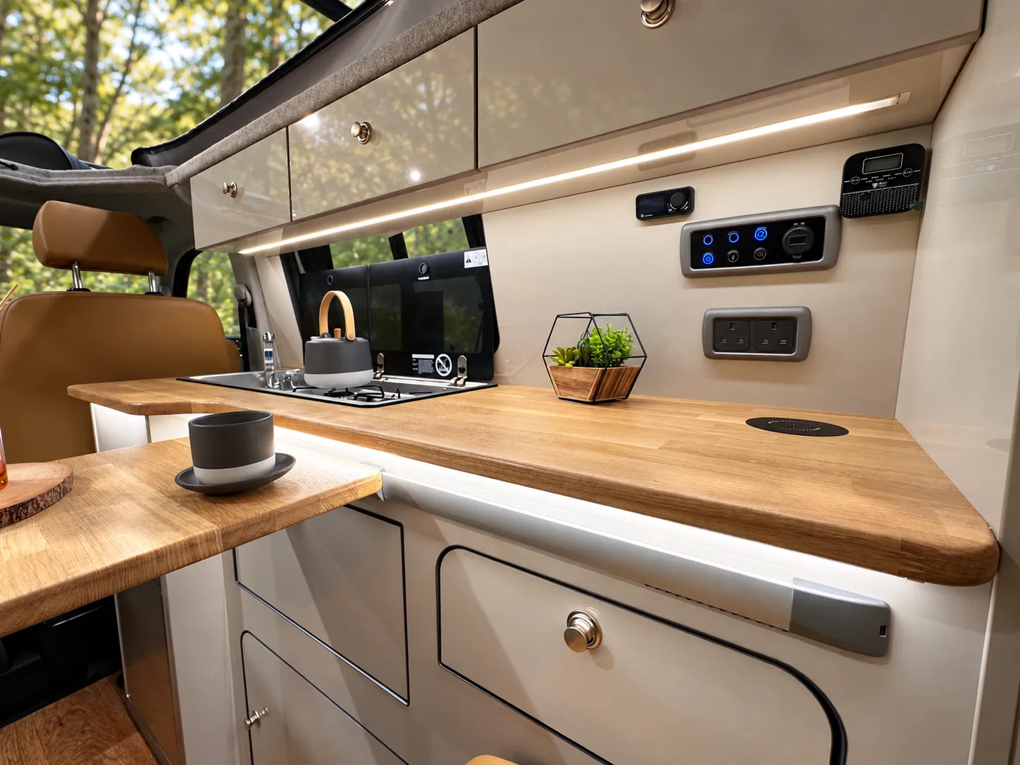 Vanlord camper kitchen with an oak worktop, hob and sink