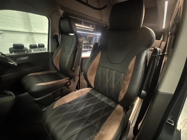 Black and champagne Custom Monaco front seats with approved lighting adjustment