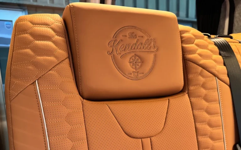 The Kendall’s embroidered headrest logo on tan Signature upholstery