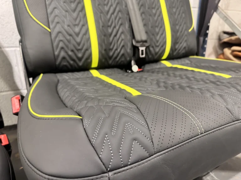 Minty Signature seat stitching, perforation and yellow piping detail